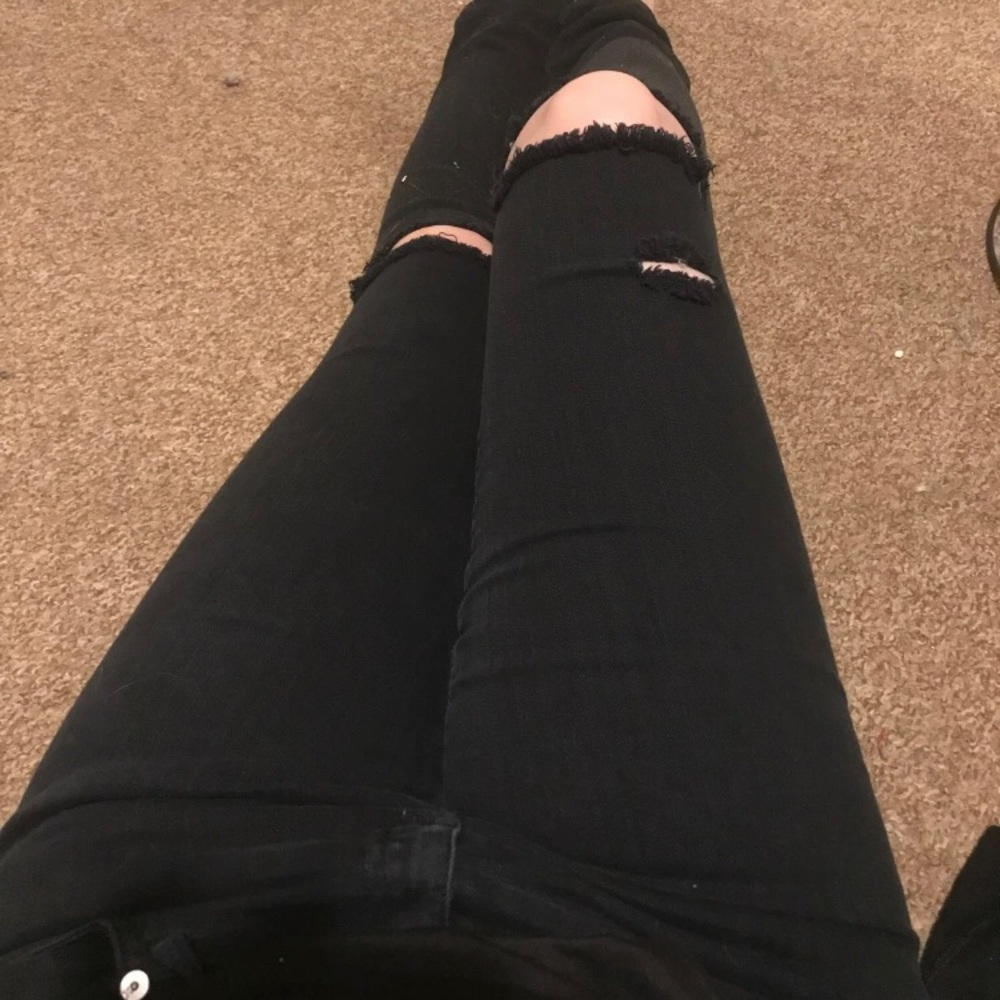 Distressed black skinny jeans
